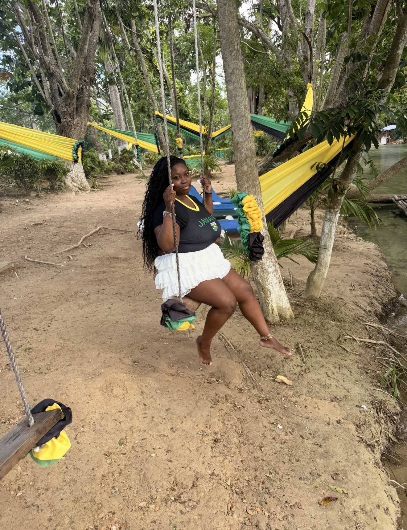 A riverside swing moment in Jamaica.